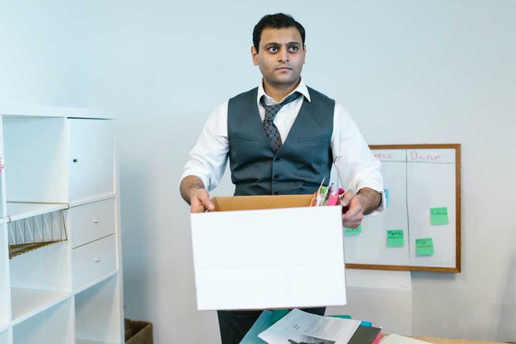 A man carrying bankers box