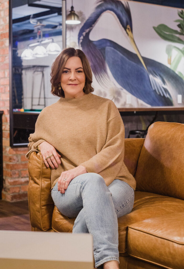 Susan-McGuire-sitting-in-a-cozy-office